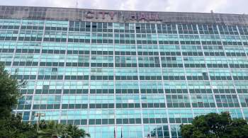 A large building with many windows labeled "CITY HALL" at the top.