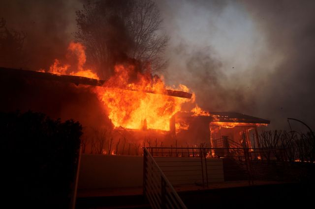 A home burning during the Palisades Fire.