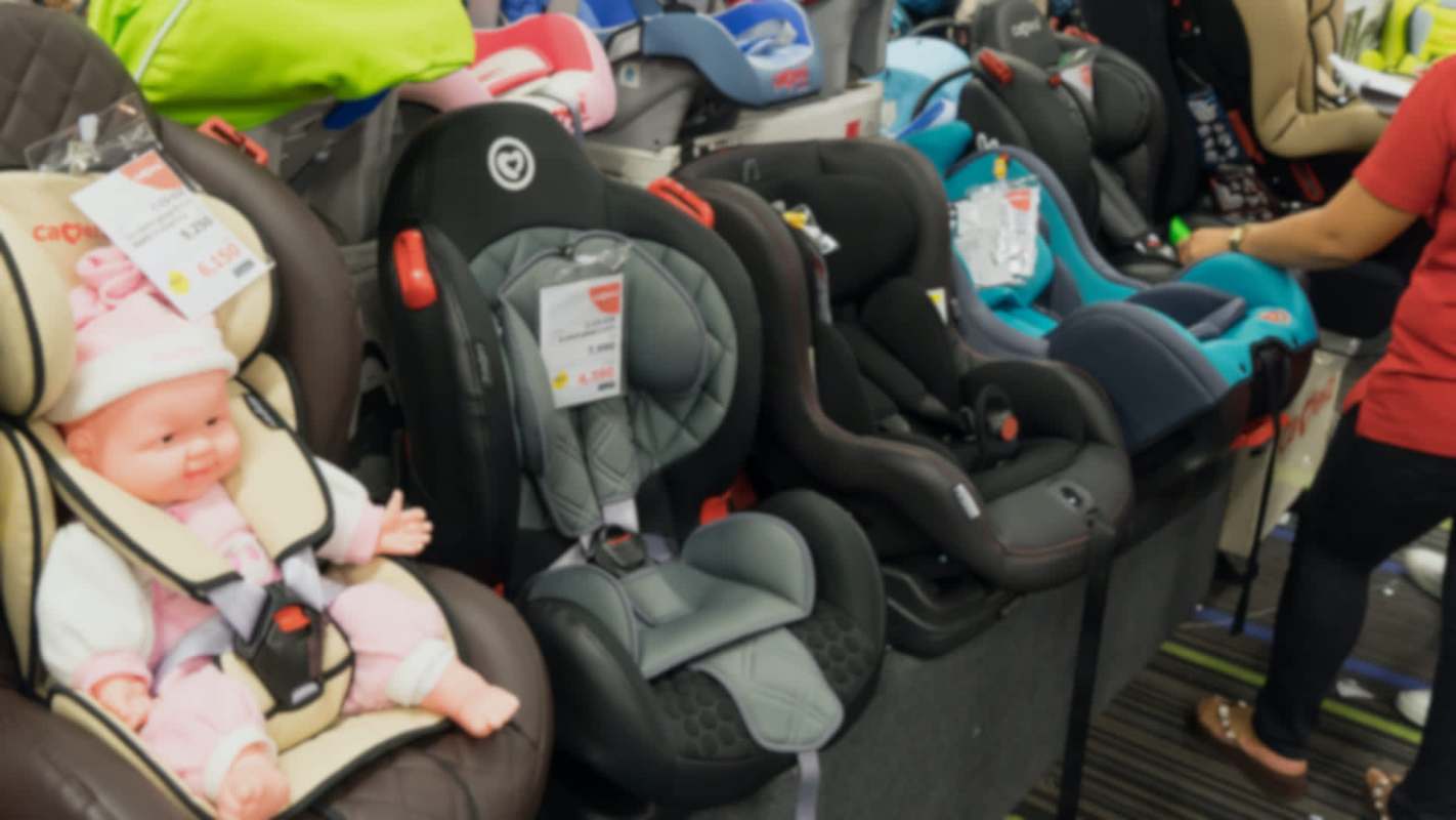 Children's car seats in a store.
