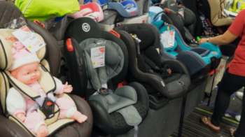 Children's car seats in a store.