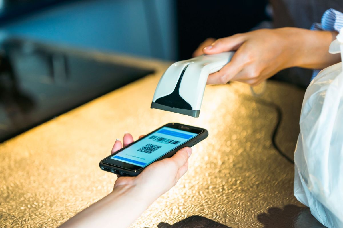 A person scanning a ticket on a smartphone.