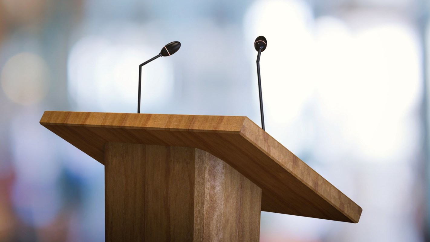 A podium with microphones.
