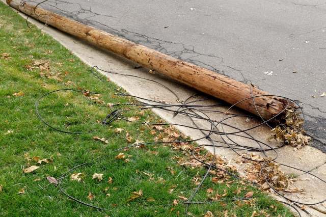 A downed utility pole and power lines.