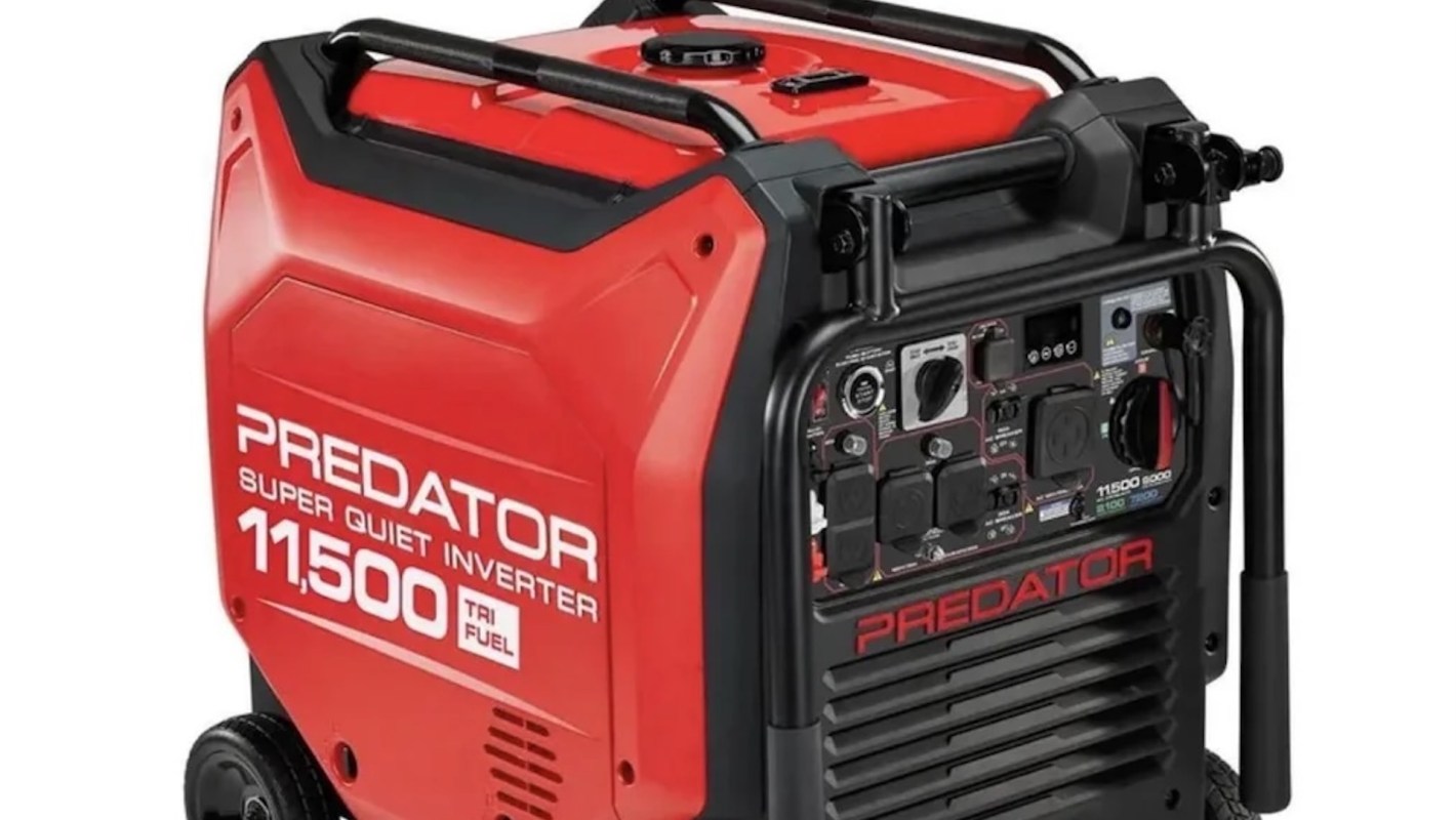 A red and black inverter generator with various outlets and controls.