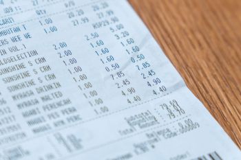 A printed receipt listing multiple items and their prices.