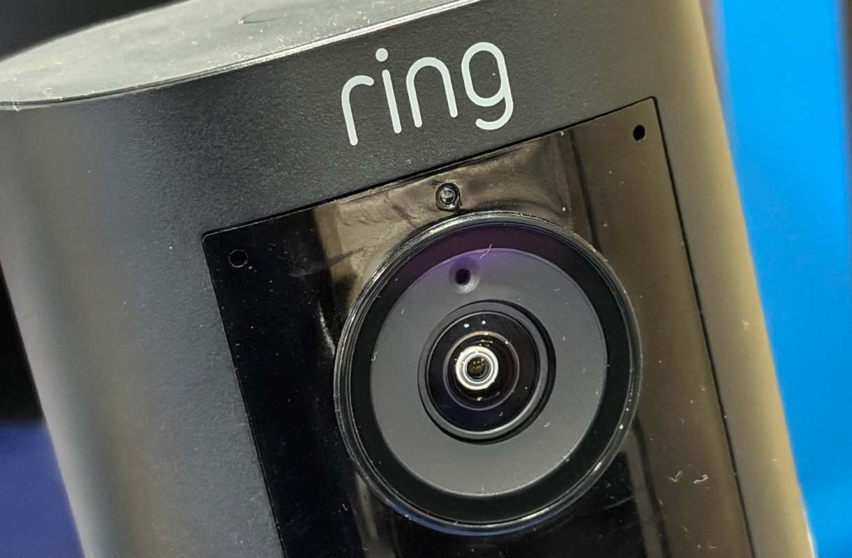 A black security camera with the brand name "ring" visible.