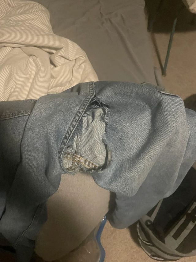 A pair of torn blue jeans.