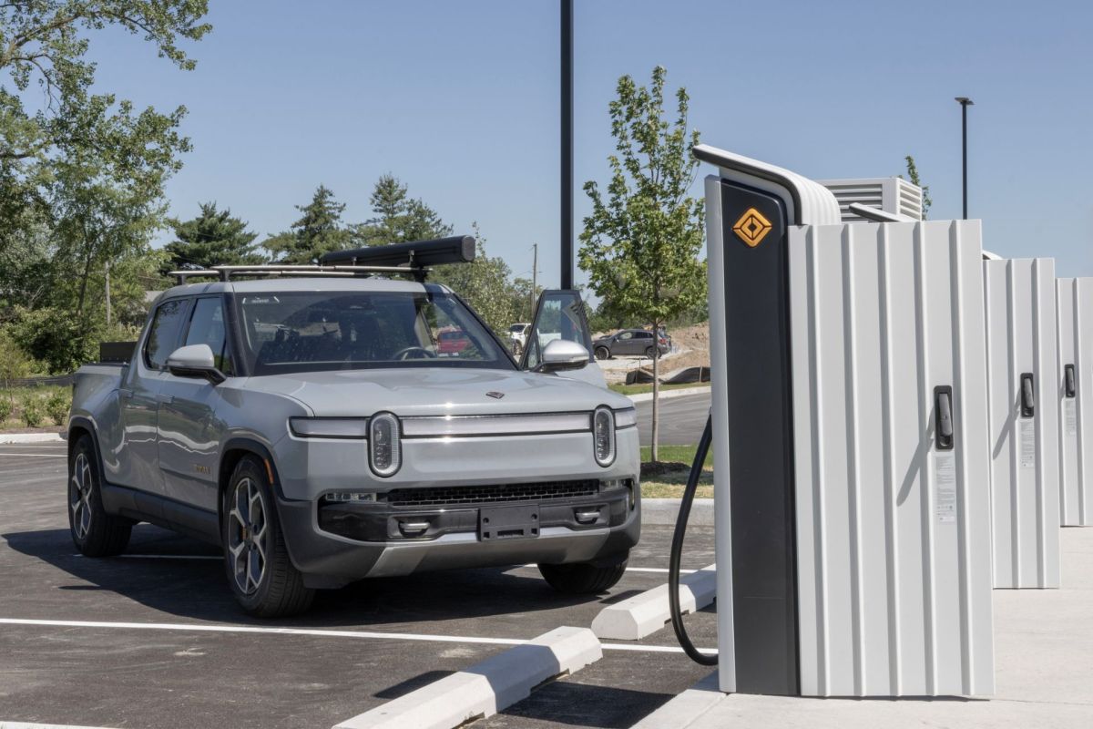 A Rivian truck at a charging station.