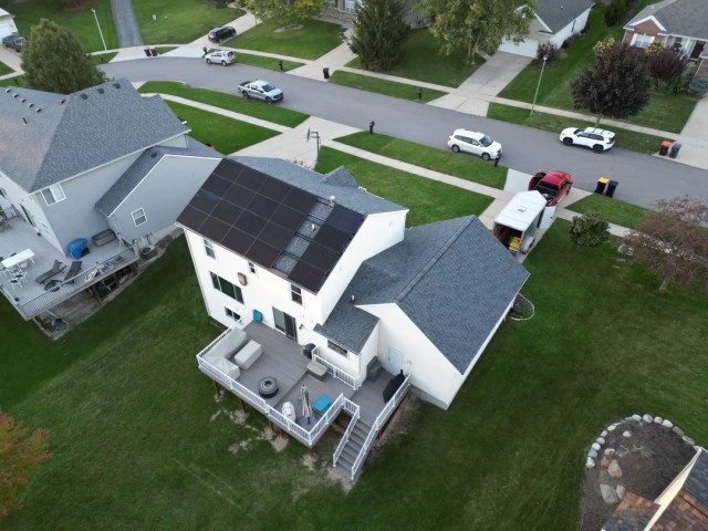 A house with rooftop solar panels.