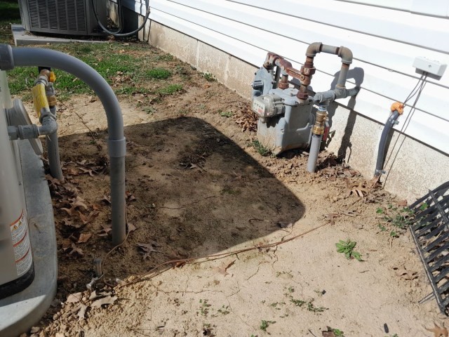 Exposed wires as part of a generator installation.