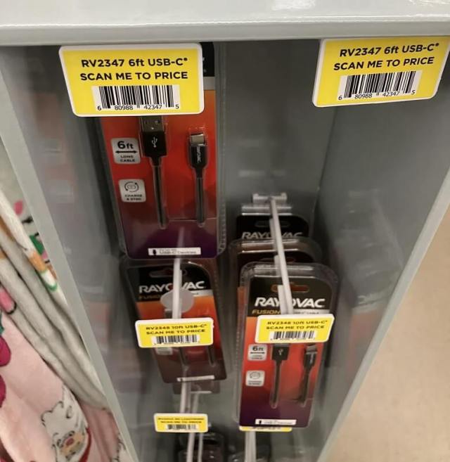 "Scan me" signs with Rayovac charging cables. 