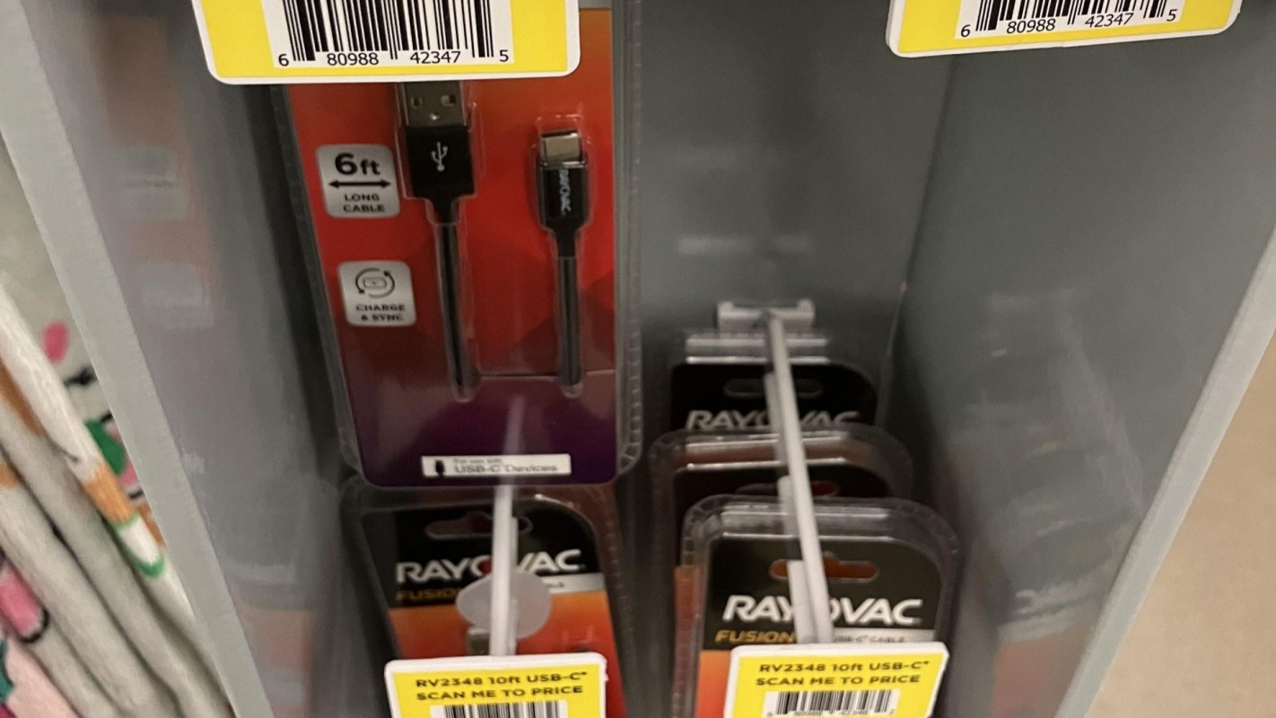 "Scan me" signs with Rayovac charging cables.