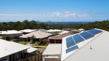 A house with rooftop solar panels.