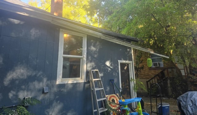 Siding pulling away from a home.