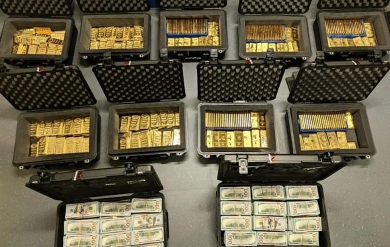 Cases filled with gold bars and cash.