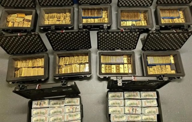 Cases filled with gold bars and cash.