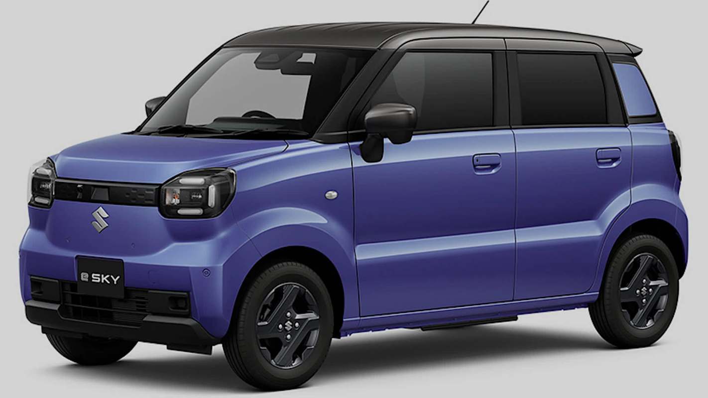 A purple Suzuki car with a black roof parked against a neutral background.