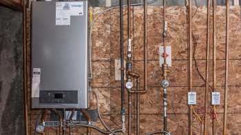 A wall-mounted tankless water heater.