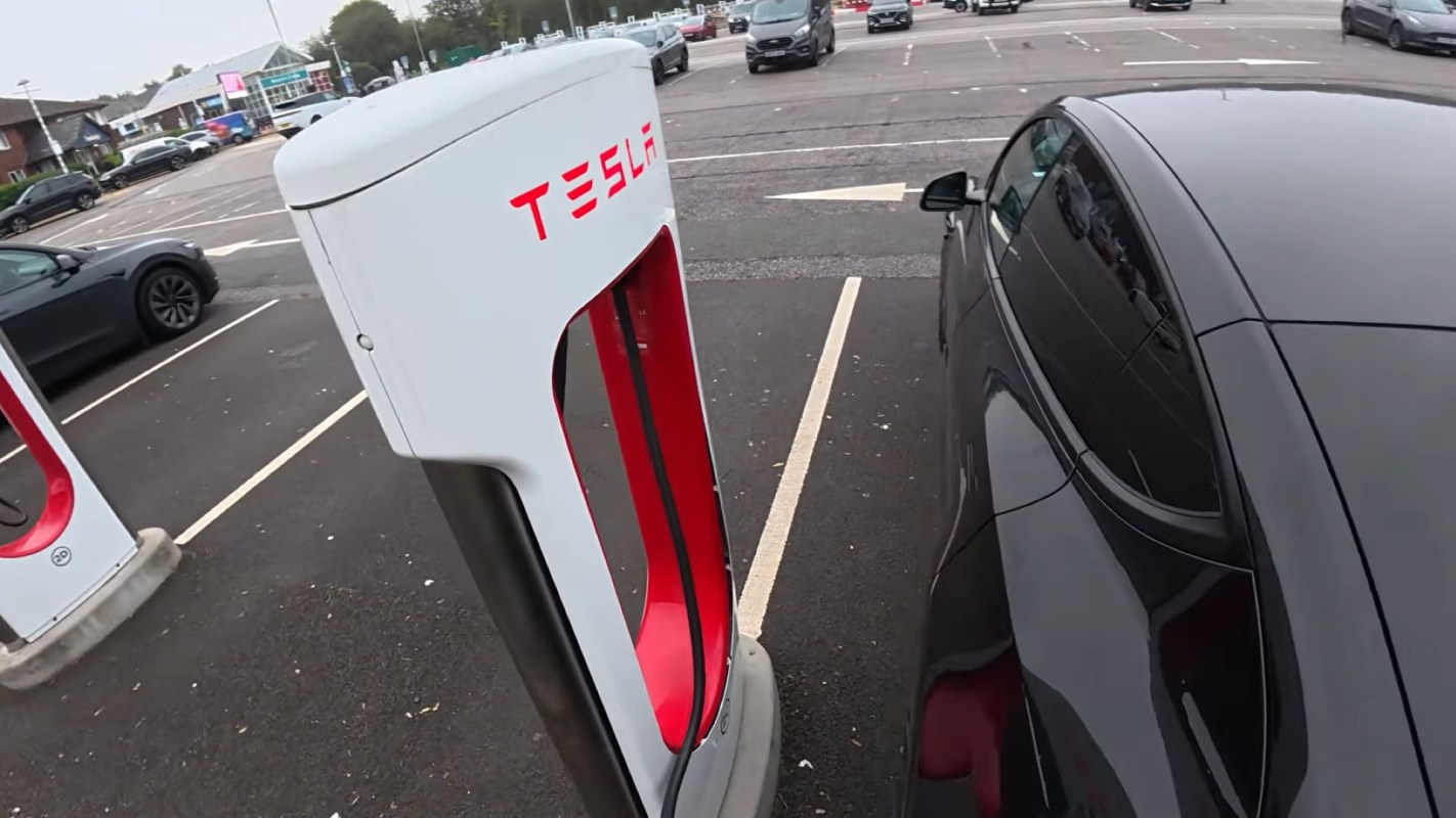 A Tesla plugged into a charger.