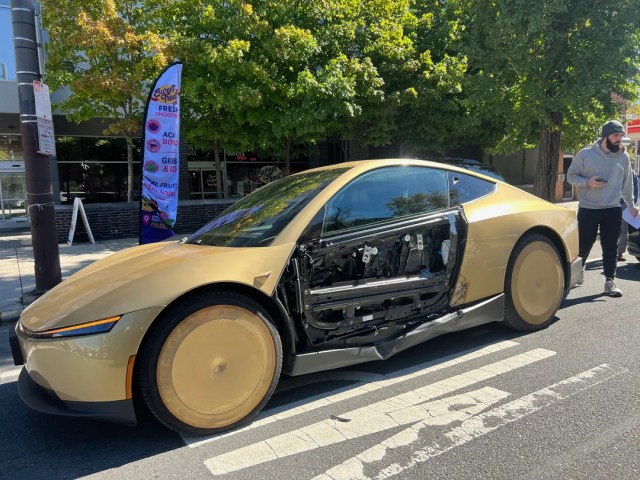 A car with the door panel missing.