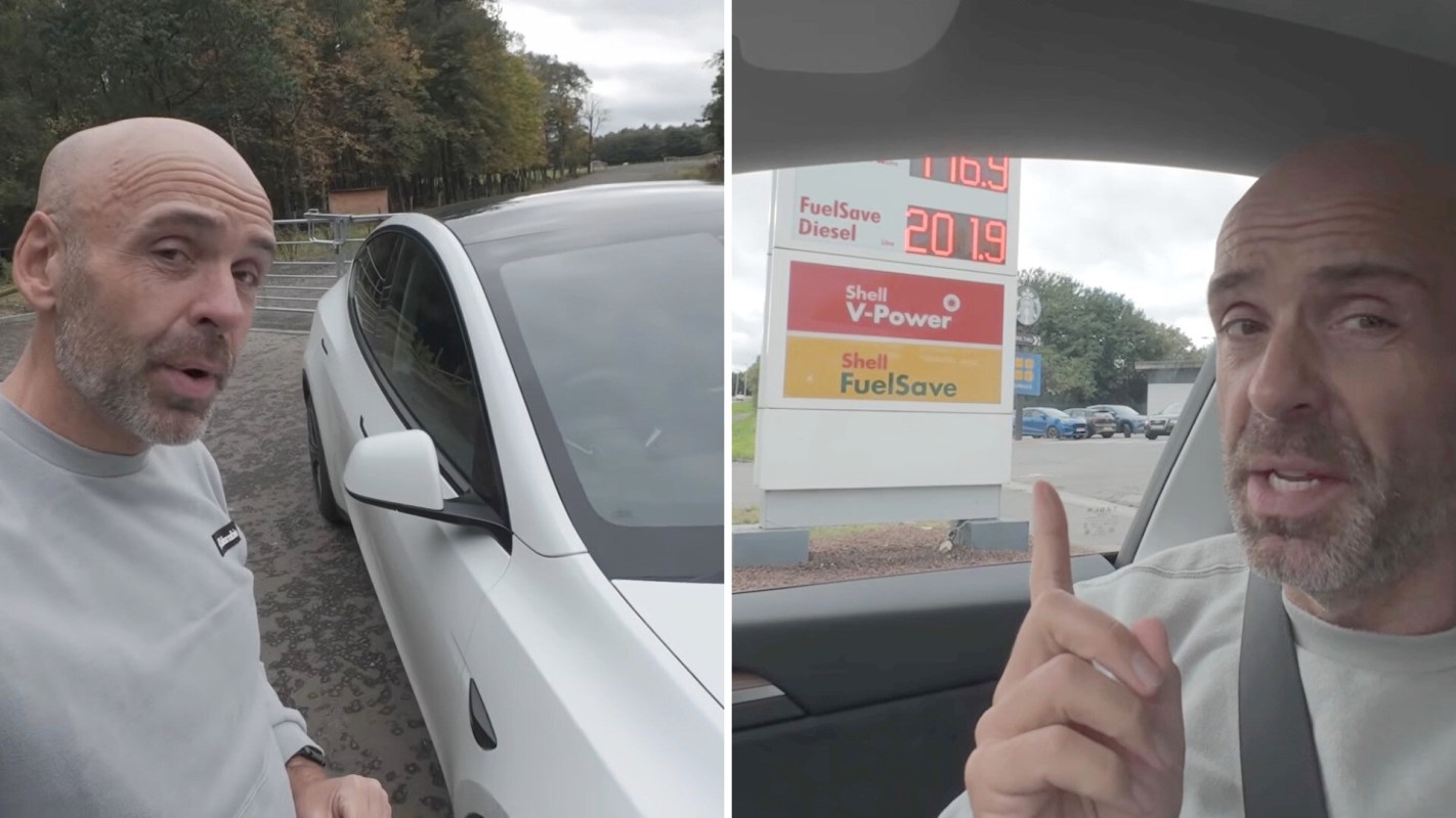 A man stands next to a white Tesla, then gestures toward a gas station sign displaying fuel prices.
