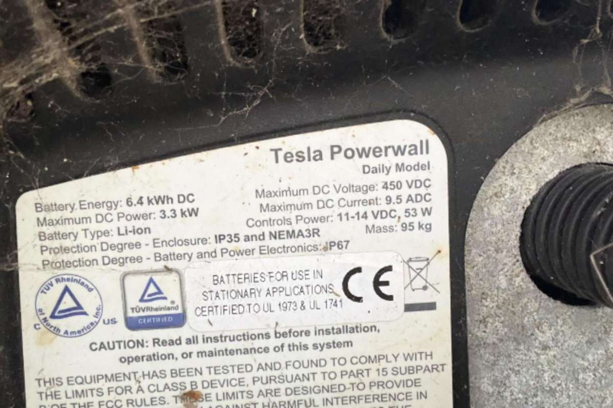 A label from a Tesla Powerwall showing specifications and safety information.