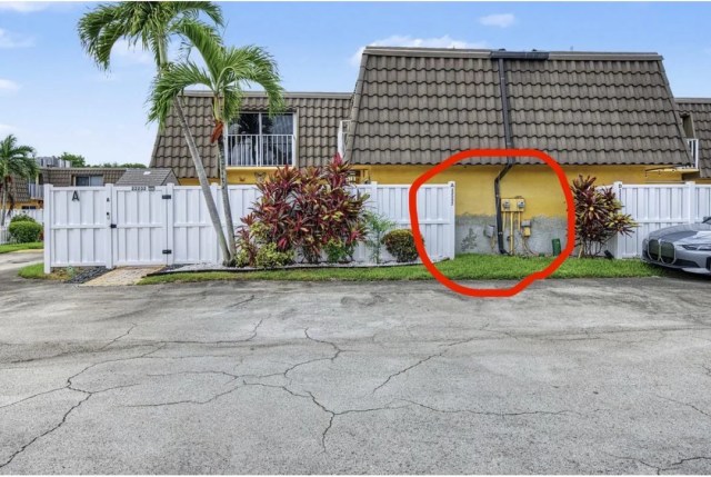 The exterior of a house with an area for a planned EV charger circled.