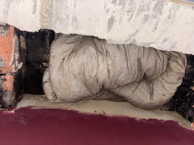 A comforter in a chimney flue.