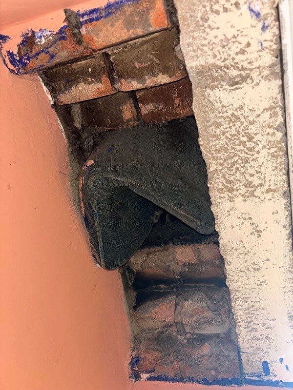 A comforter in a chimney flue.