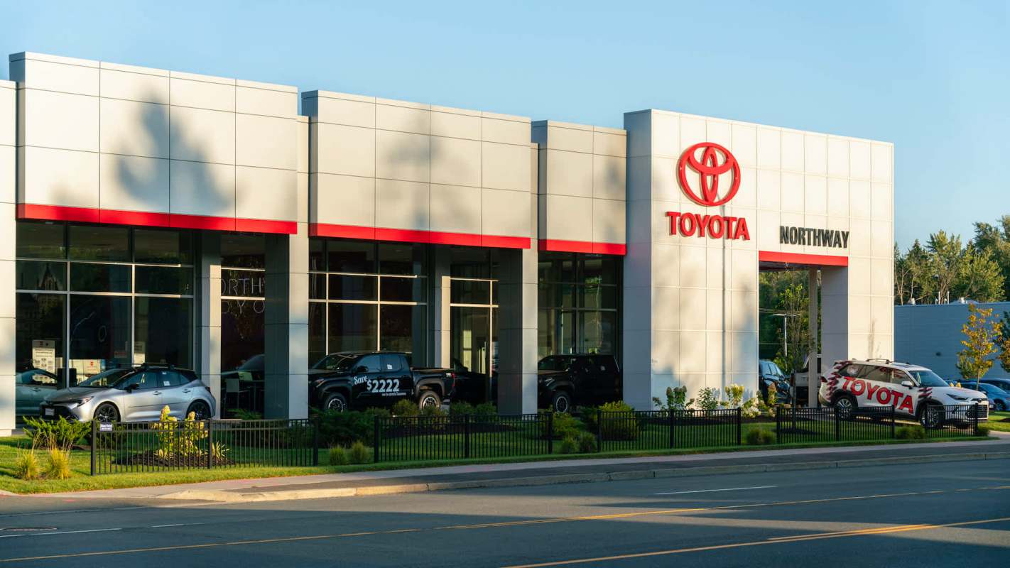 A Toyota dealership featuring multiple cars and a prominent sign displaying "Toyota Northway."