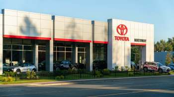 A Toyota dealership featuring multiple cars and a prominent sign displaying "Toyota Northway."