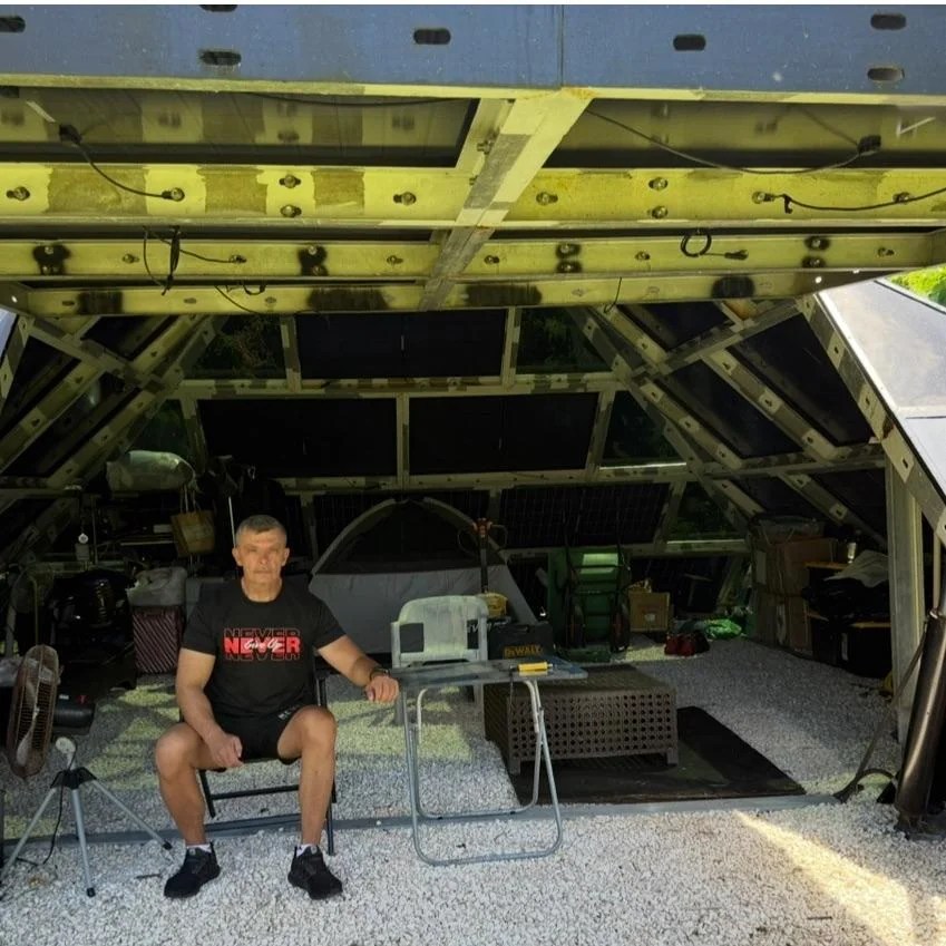 A man sitting inside the pyramid.