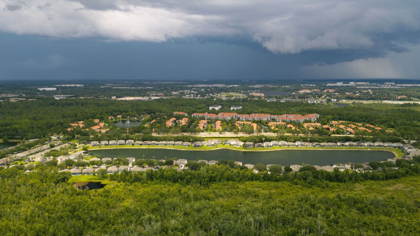 Vacation rental homes under a stormy sky.