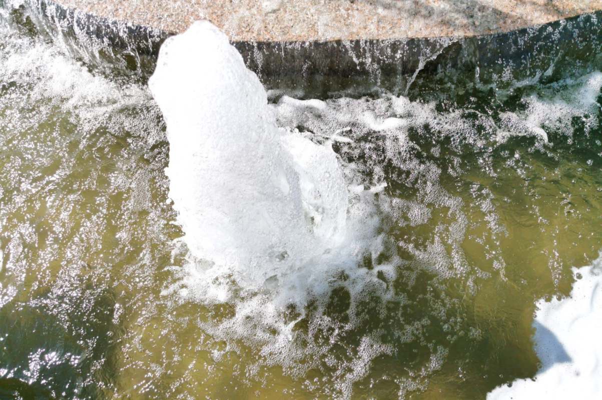 Water shooting up from a water pipe break.