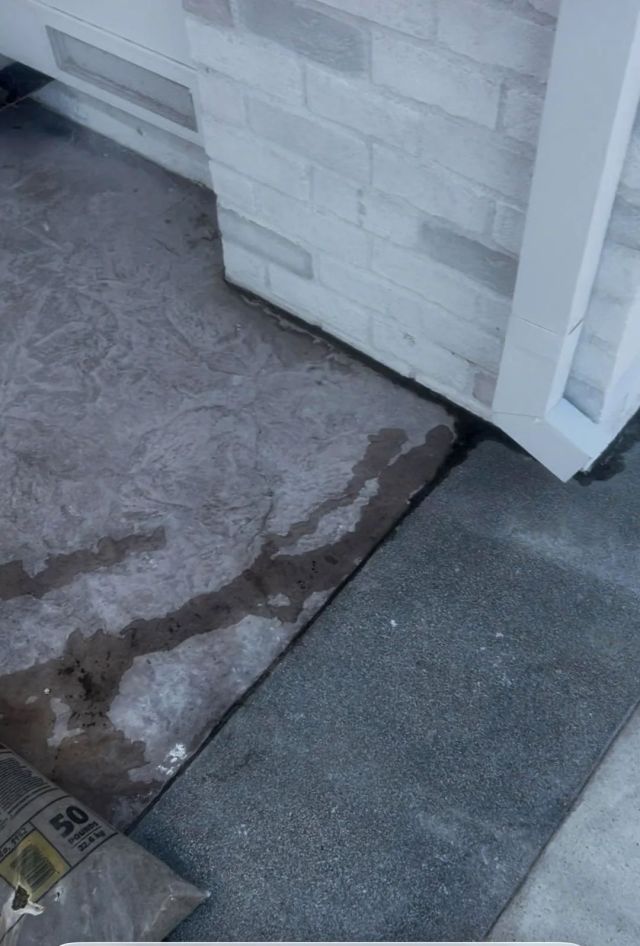 Water running toward a house.