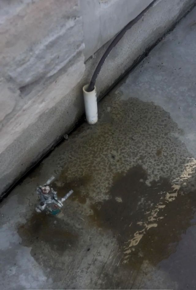 Water running toward a house.