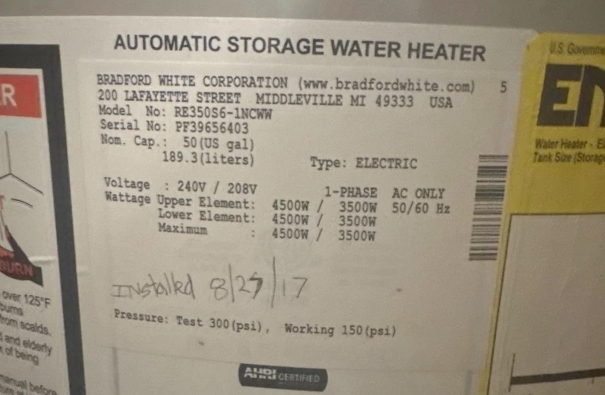 A water heater information label displaying specifications and installation details.