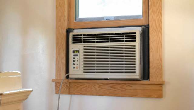 Two window units cut one homeowner's electric bill by $200 by cooling only occupied rooms
